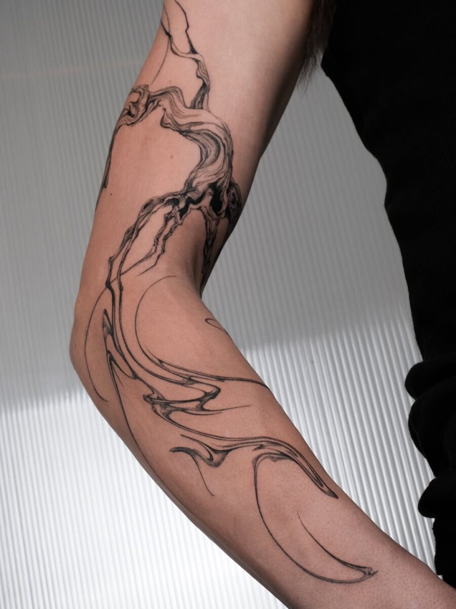 Elegant minimalism captured in floral ink design. Tattoo on skin