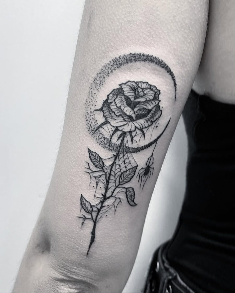 Elegant rose tattoo with moon accents Tattoo on skin