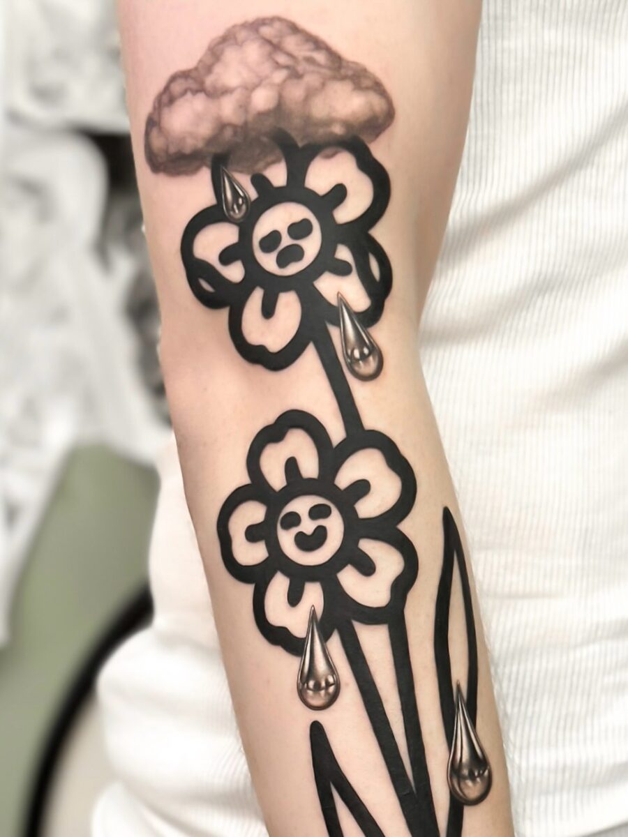 Expressive dead flower tattoo with charm Tattoo on skin