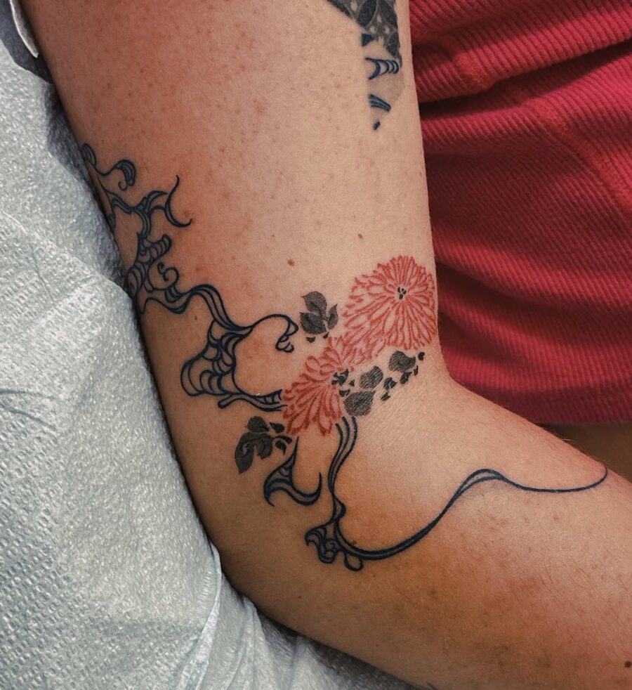 Intricate dead flower design with vibrant colors Tattoo on skin
