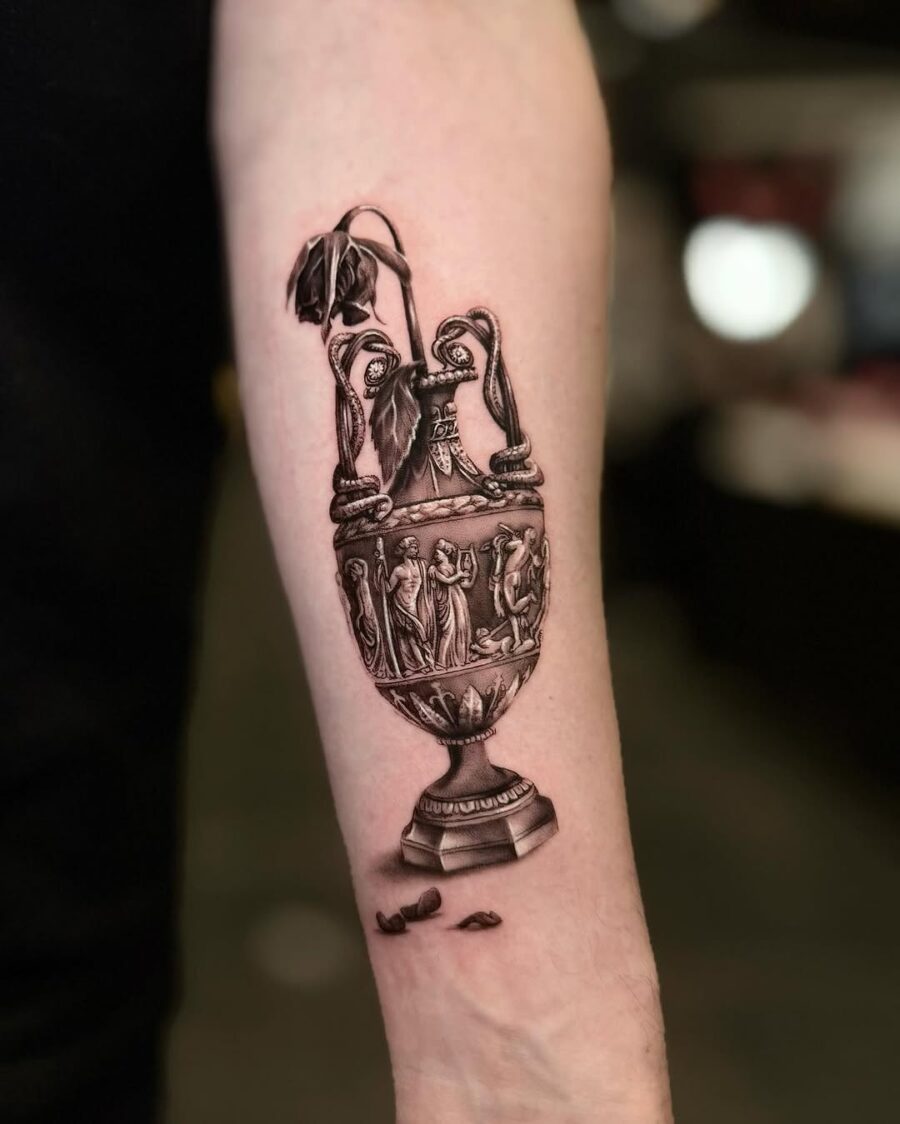 Intricate vase tattoo with a wilted flower dead flower tattoos