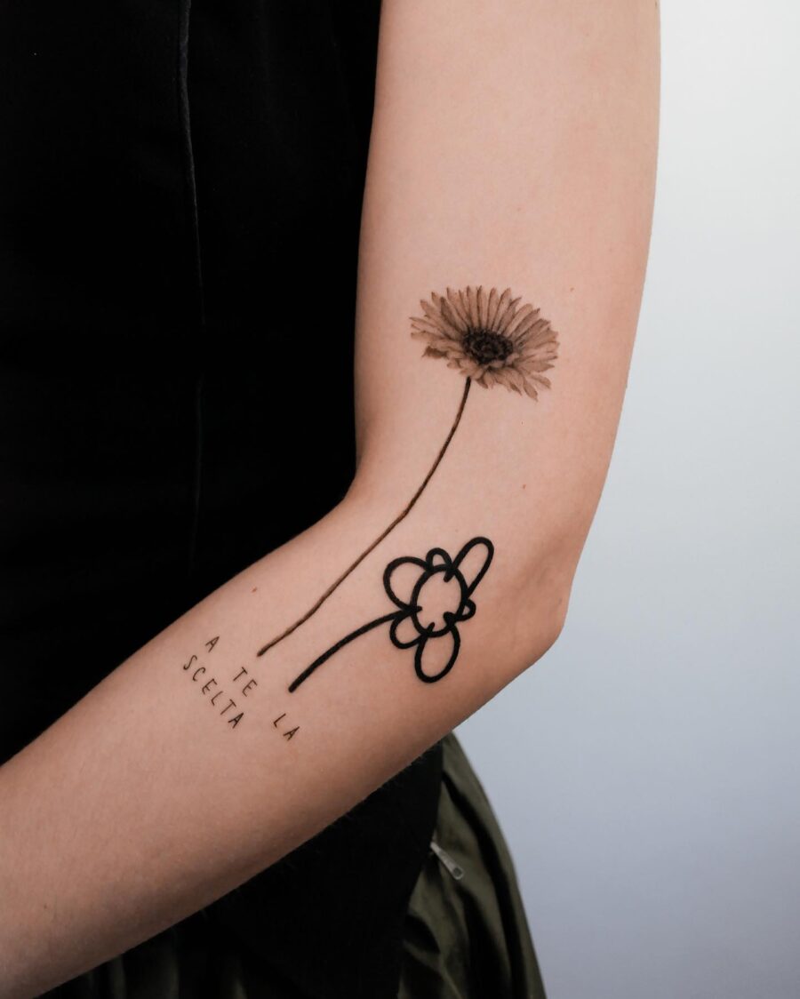 Minimalist dead flower tattoo with elegant lines Tattoo on skin