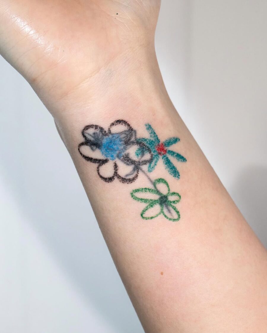 Playful floral ink with colorful outlines Tattoo on skin