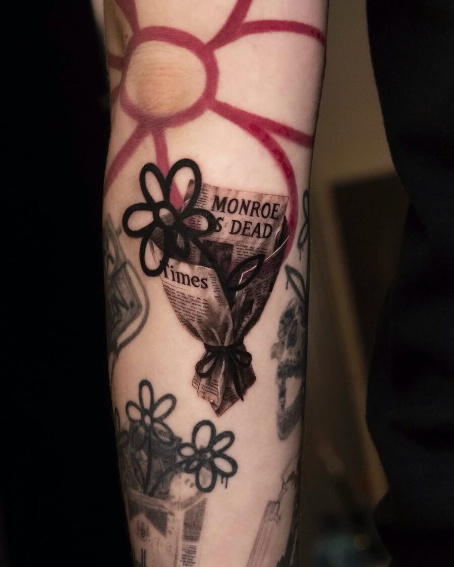 Unique dead flower tattoo with newspaper design Tattoo on skin