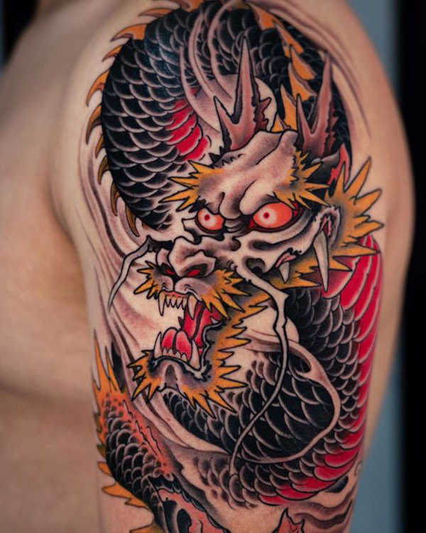 Black and Orange Asian Dragon Shoulder Tattoo Tattoo on skin