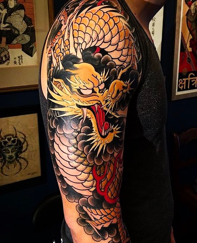 Black and Orange Dragon Half Sleeve Tattoo Tattoo on skin