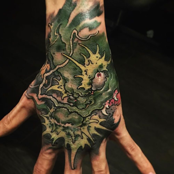 Dragon Head Tattoo on Back of Hand Tattoo on skin