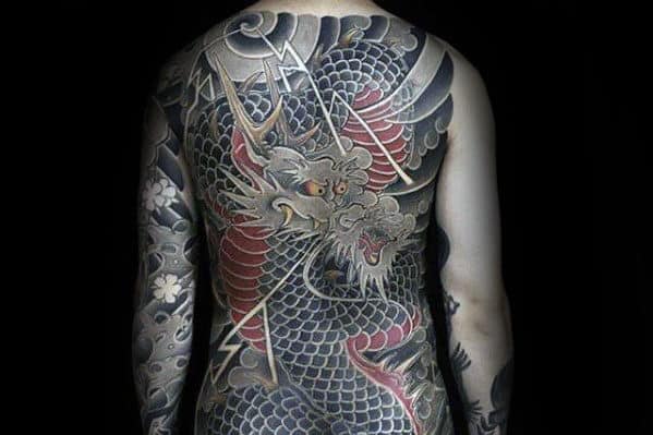 Enormous Black and Red Dragon Body Tattoo Tattoo on skin