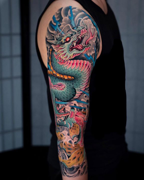 Powerful Blue Dragon Tattoo on Upper Arm Tattoo on skin