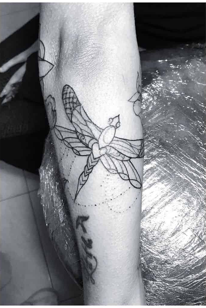 Free-Flowing Semi Geometric Dragonfly Tattoo Design Tattoo on skin