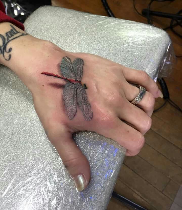 Greyish-brown Dragonfly Tattoo Design Tattoo on skin