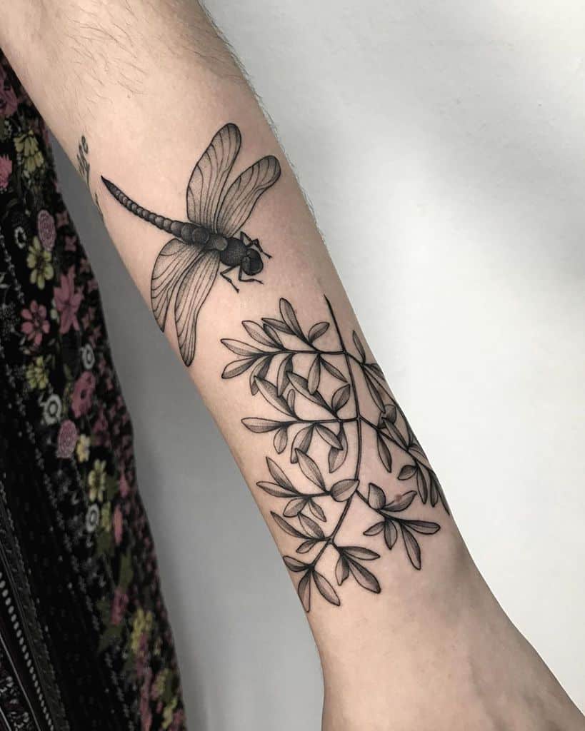 Monochromatic Flower-Loving Dragonfly Design Tattoo on skin