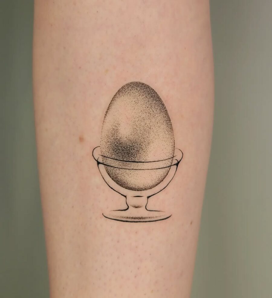 Minimalist Egg Tattoo in a Bowl Tattoo on skin