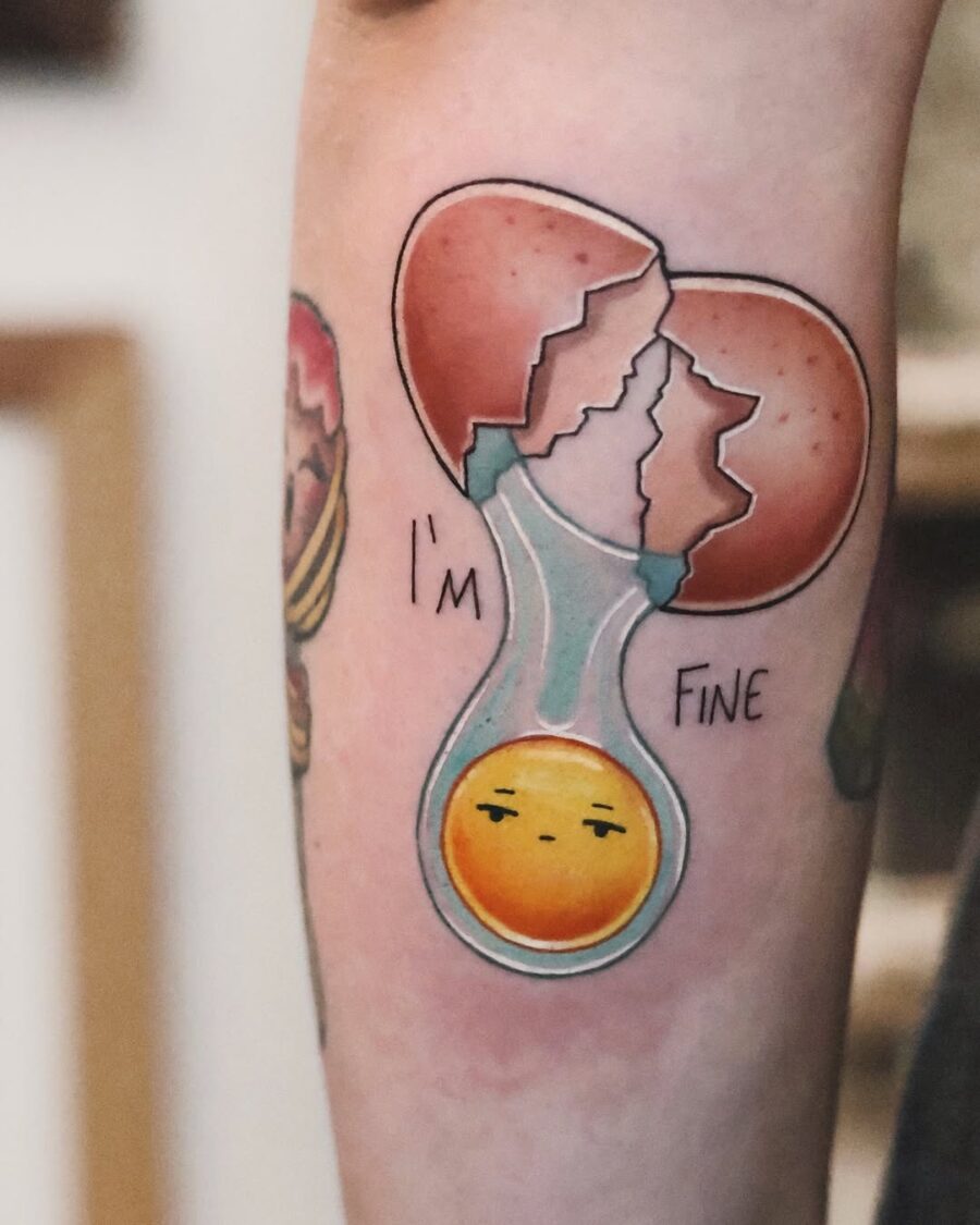 Playful egg tattoo with a humorous twist egg tattoos
