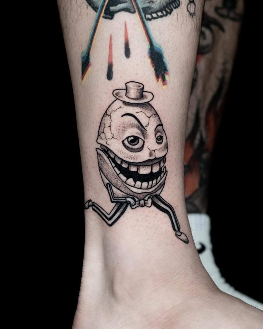 Whimsical egg tattoo with a playful vibe Tattoo on skin