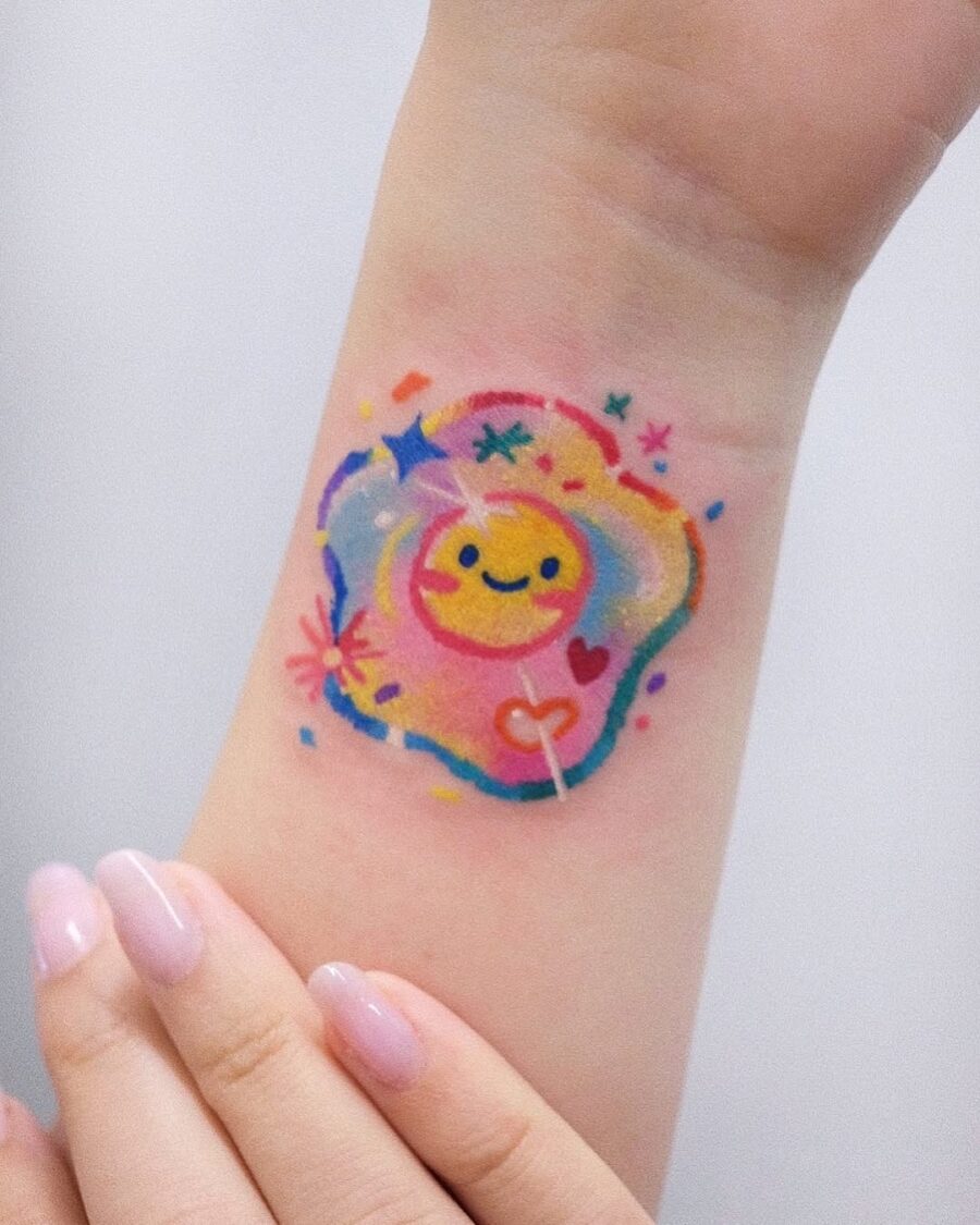 Whimsical egg tattoo with joyful sunny vibes Tattoo on skin