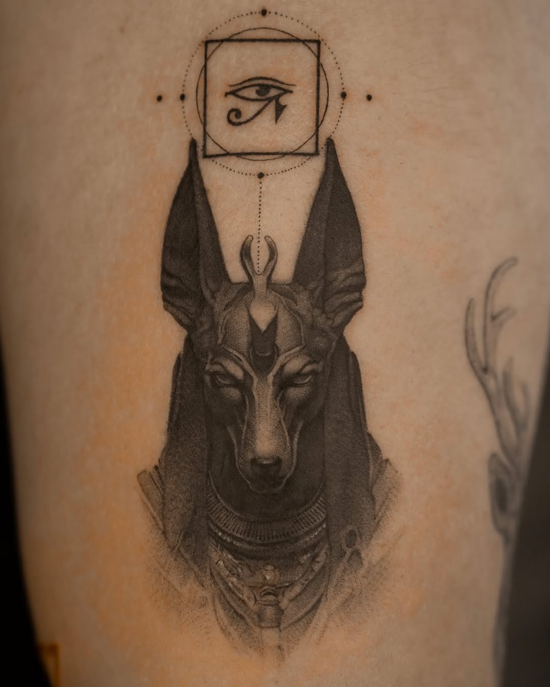 Intricate Anubis Design with Mystical Elements Tattoo on skin