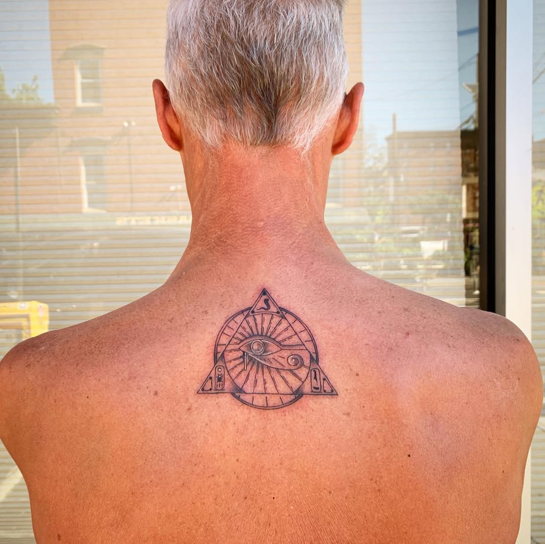 Intricate Egyptian Eye of Horus Design Tattoo on skin