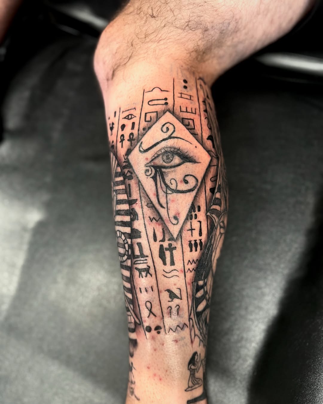 Intricate Egyptian Eye Tattoo Design on Leg Tattoo on skin