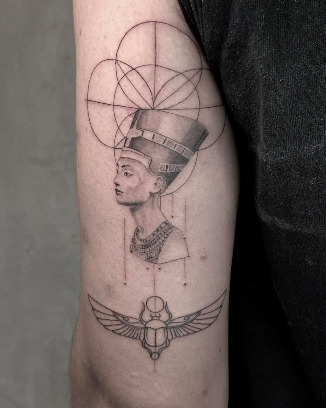 Intricate Egyptian tattoo showcasing Nefertiti's elegance Tattoo on skin