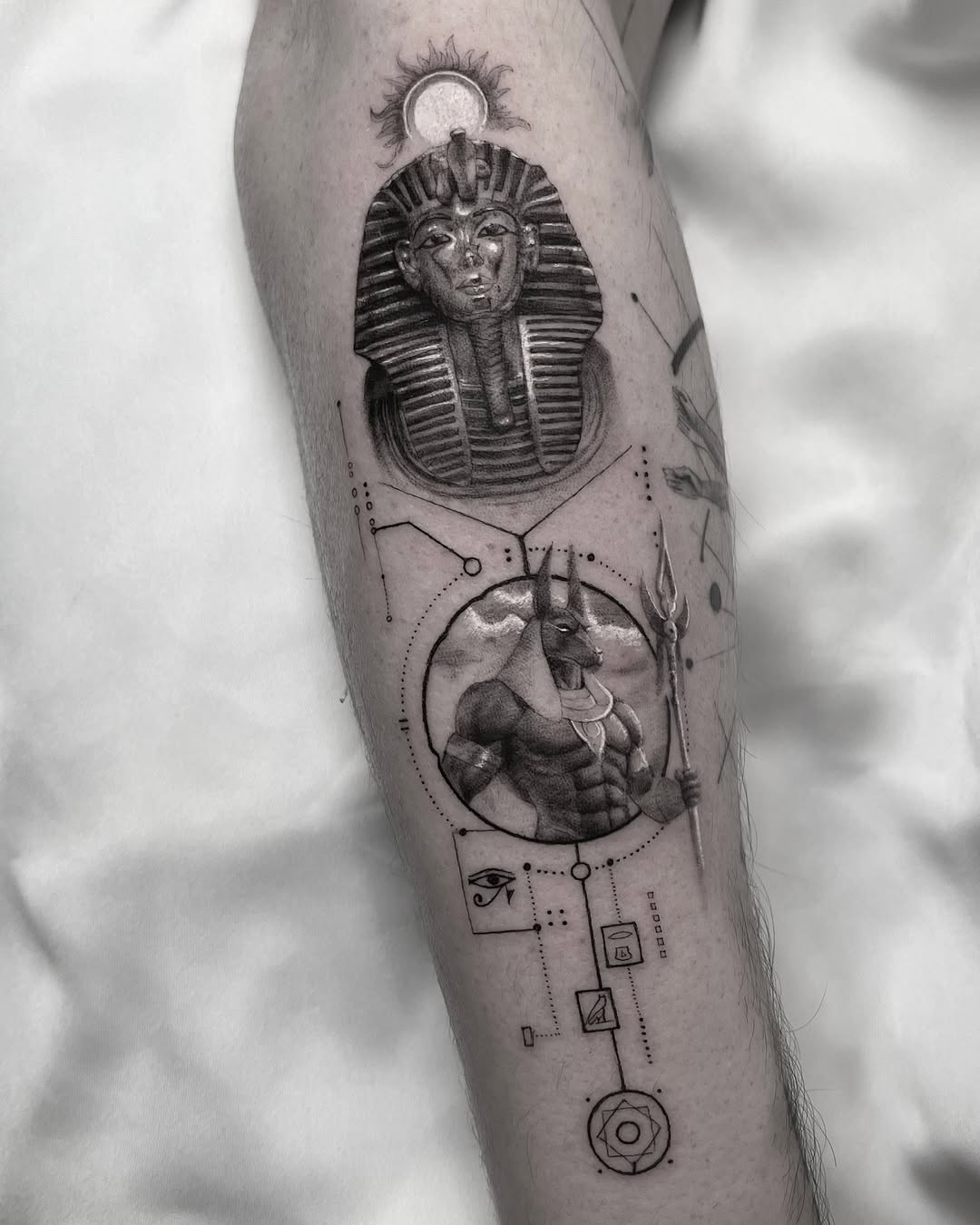 Intricate Egyptian-themed tattoo design on arm Tattoo on skin