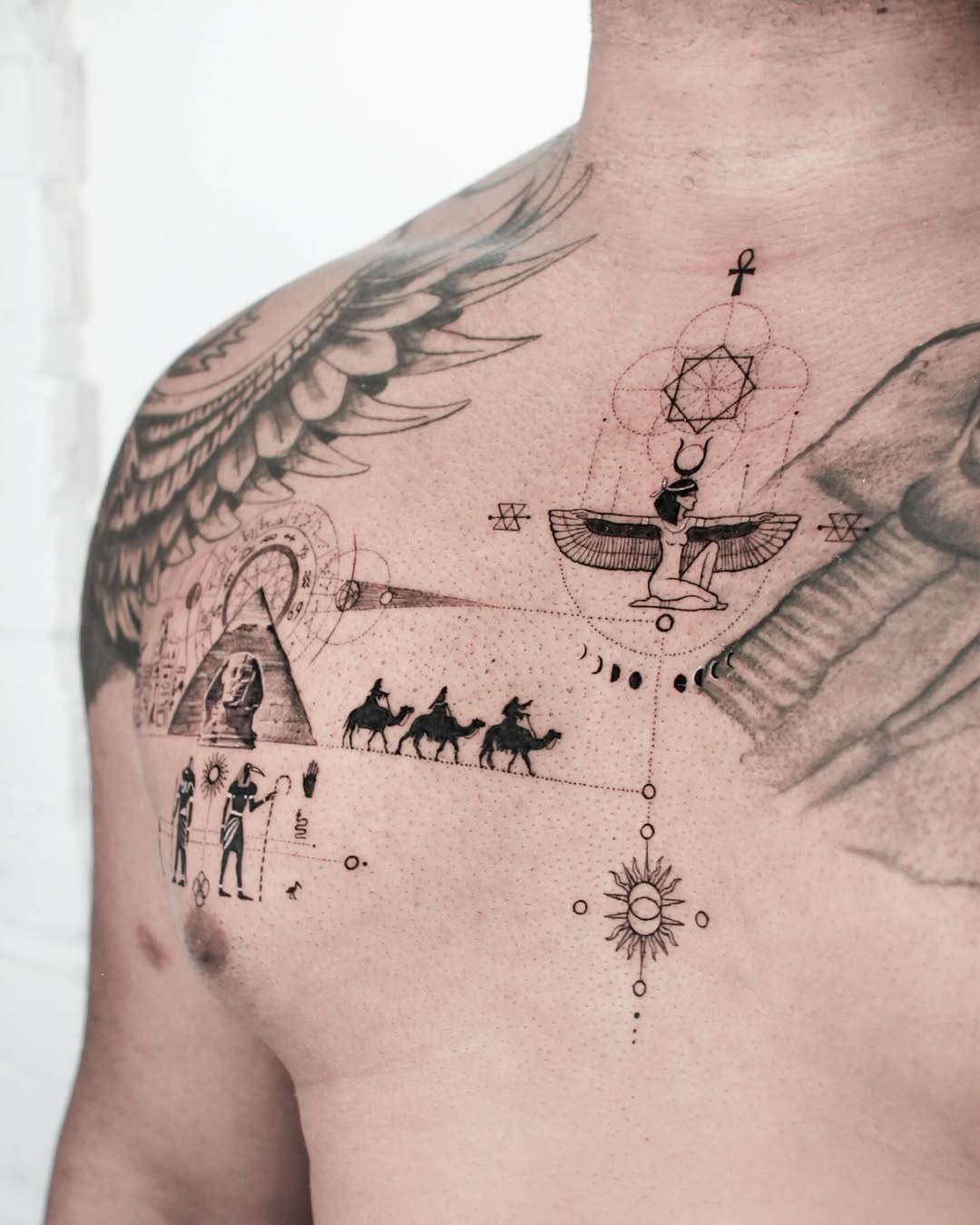 Symbolic Egyptian Tattoo with Hieroglyphs Tattoo on skin