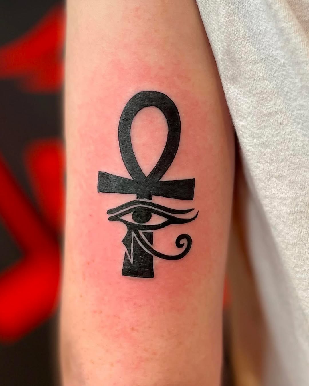 The Eternal Life Symbol with a Mystical Eye Tattoo on skin