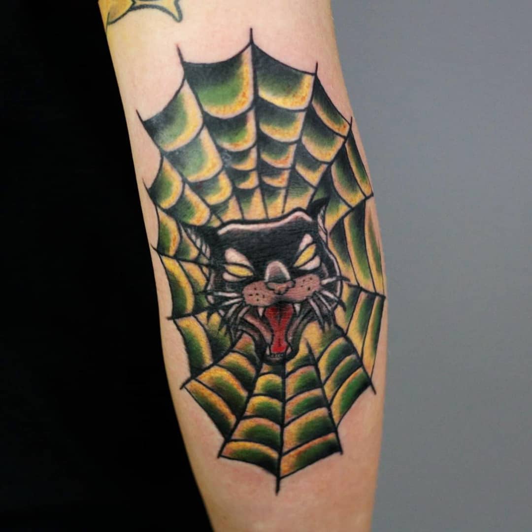 Cat Head Inside Spider Web Elbow Tattoo Tattoo on skin