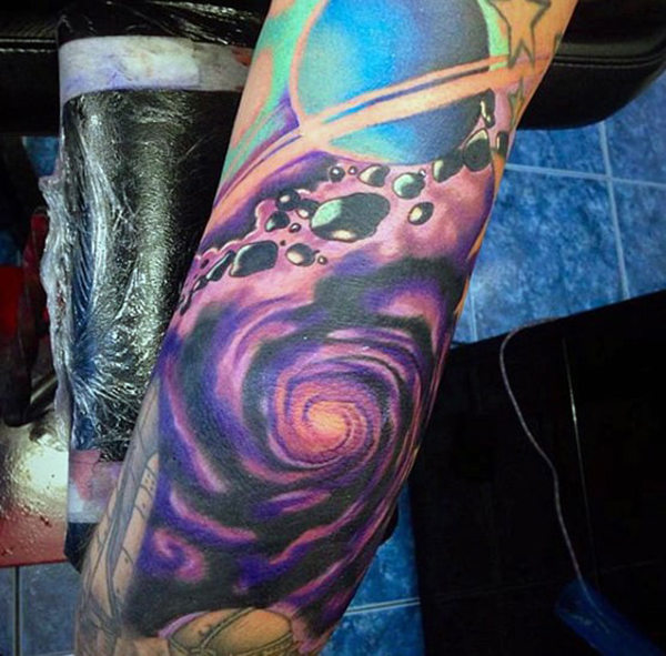 Celestial Dust Cloud and Planet Elbow Tattoo Tattoo on skin