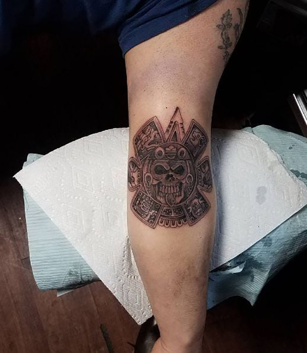 Center of Aztec Calendar Elbow Tattoo Tattoo on skin