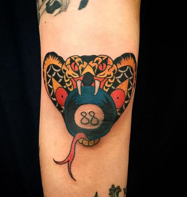 Cobra Biting a Pool Ball Elbow Tattoo Ideas Tattoo on skin