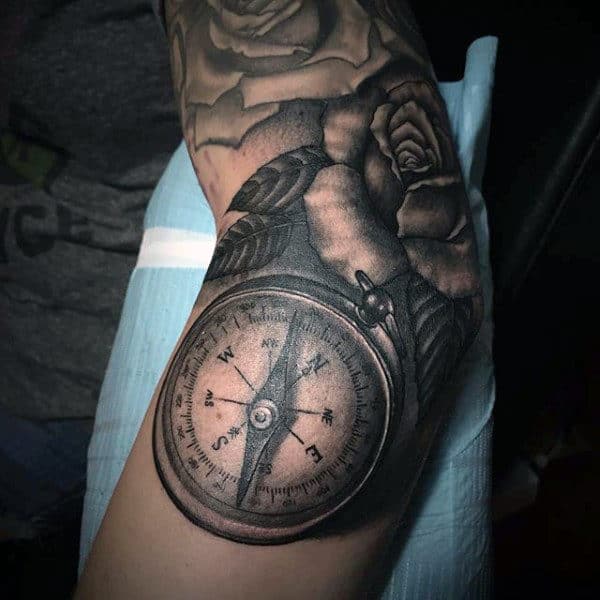 Compass Tattoo Over a Blooming Rose Elbow Tattoo Ideas Tattoo on skin