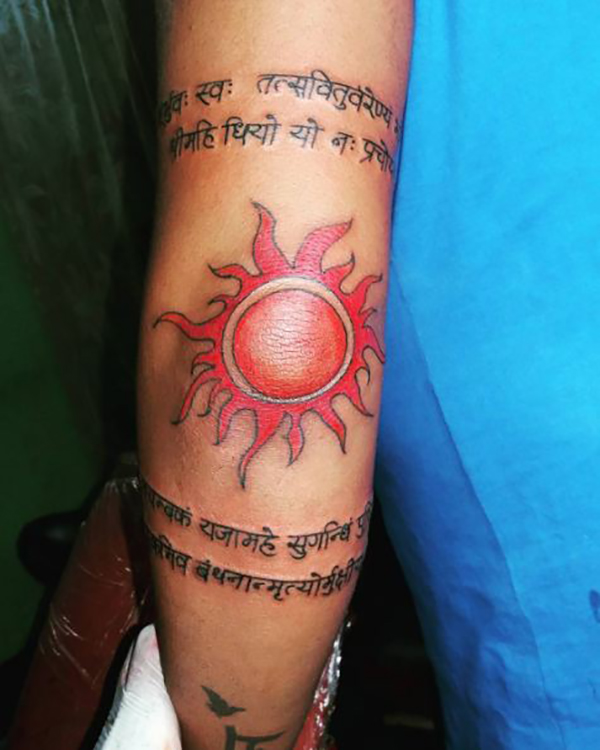 Orange Sun with Text Below and Above Elbow Tattoo Ideas Tattoo on skin