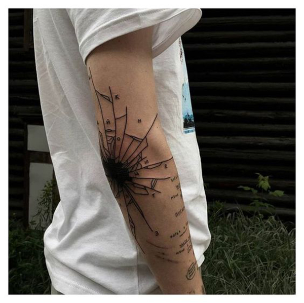 Shatter Pattern and Letters Over Elbow Tattoo Designs Tattoo on skin