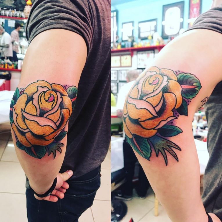 Yellow Rose with Green Leaves Elbow Tattoo Tattoo on skin