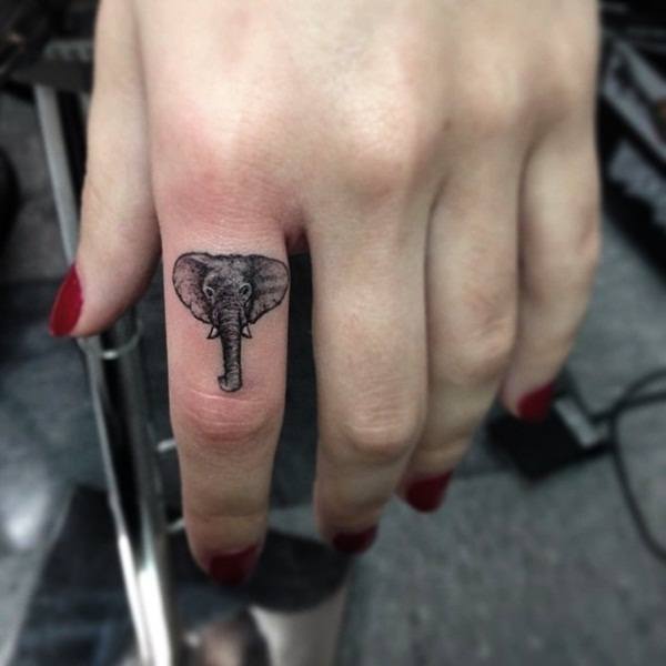 Micro Elephant Head Middle Finger Tattoo Tattoo on skin