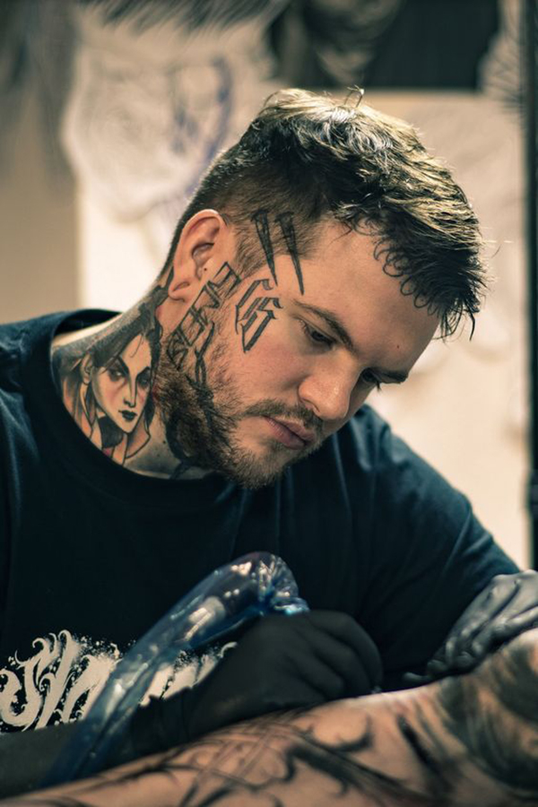 Double Stakes Unknown Word Face Tattoo Tattoo on skin