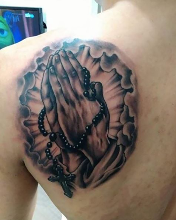Bursting Prayer Hands with Rosary Beads Faith Tattoo Tattoo on skin