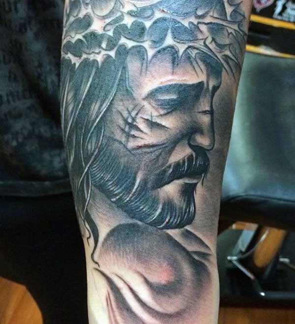 Crucified Jesus Face Portrait Tattoo Design Tattoo on skin