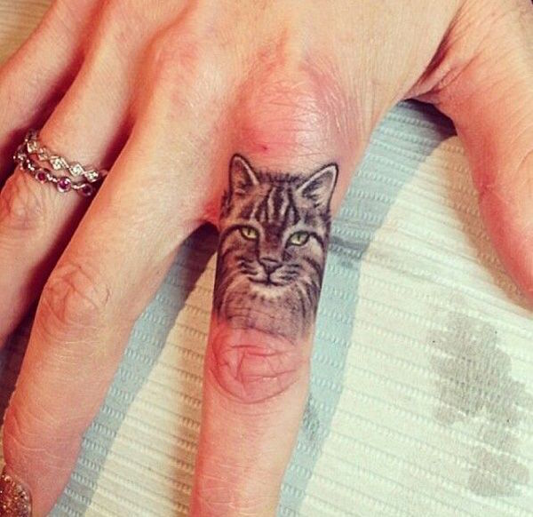 Cat Finger Tattoo Idea Tattoo on skin