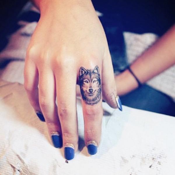 Wolf Finger Tattoo Tattoo on skin