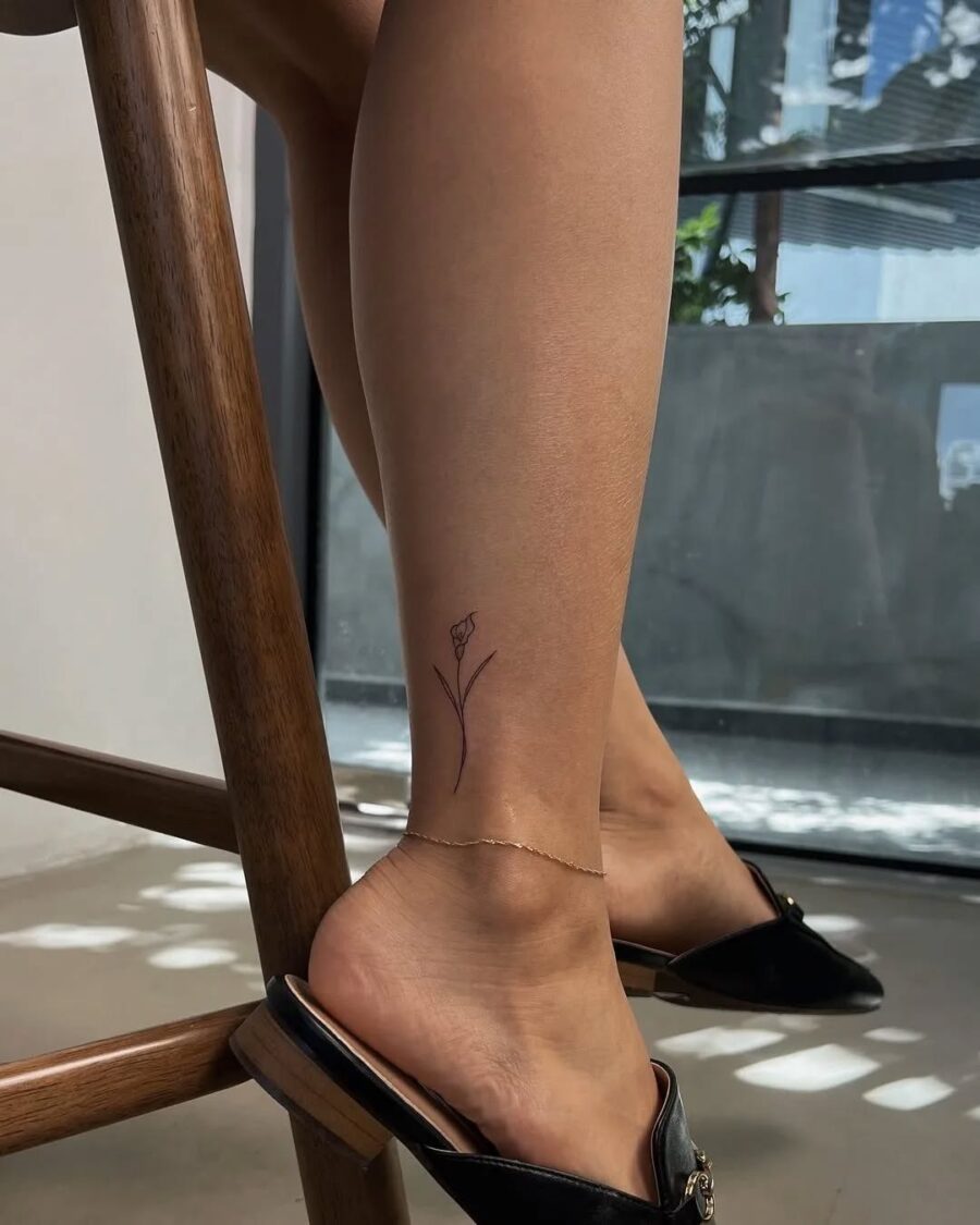 Chic minimalist flower ankle tattoo design Tattoo on skin