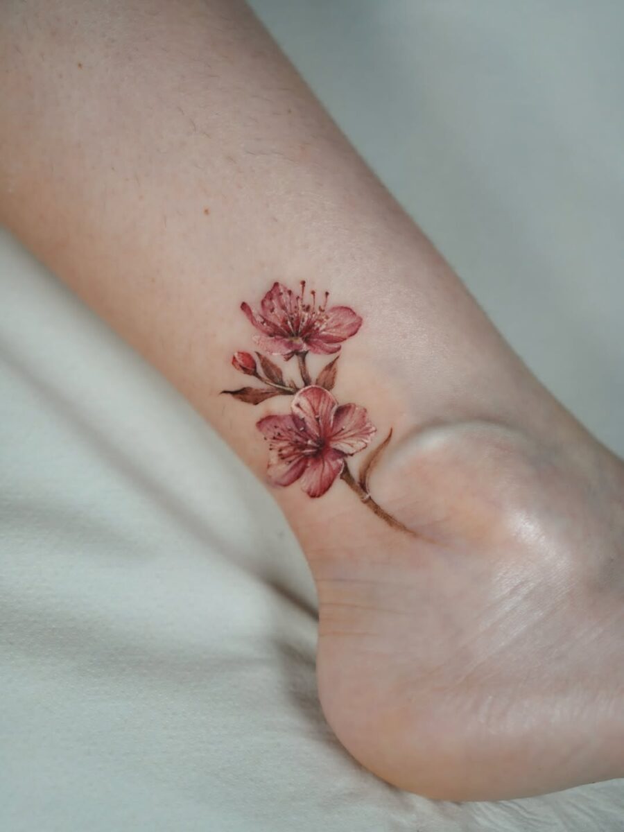 Delicate pink blooms for a graceful look Tattoo on skin