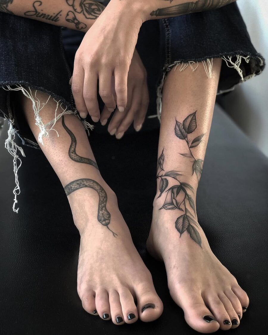 Elegant floral and bold snake ankle designs Tattoo on skin