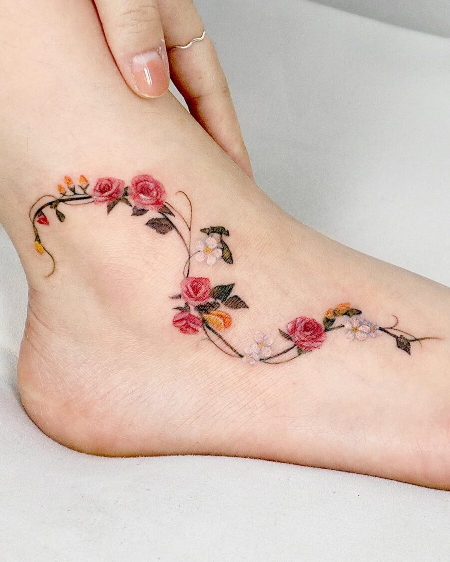 Elegant Floral Ankle Tattoo with Vibrant Roses Tattoo on skin