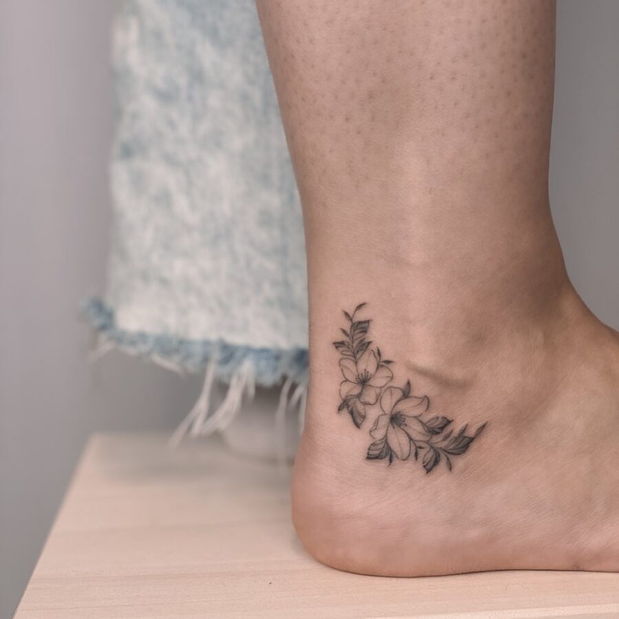 Elegant floral design enhancing ankle aesthetics Tattoo on skin