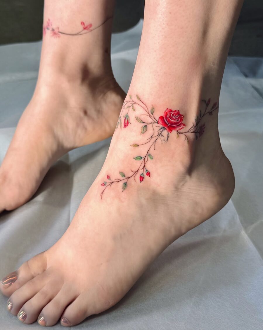 Elegant rose tattoo wraps around the ankle Tattoo on skin