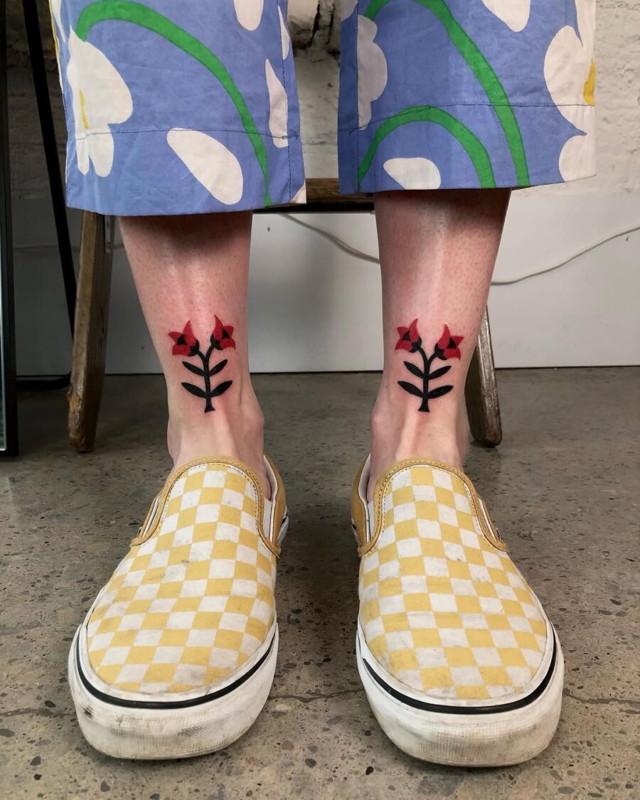 Vibrant floral ankle tattoos with bold colors Tattoo on skin