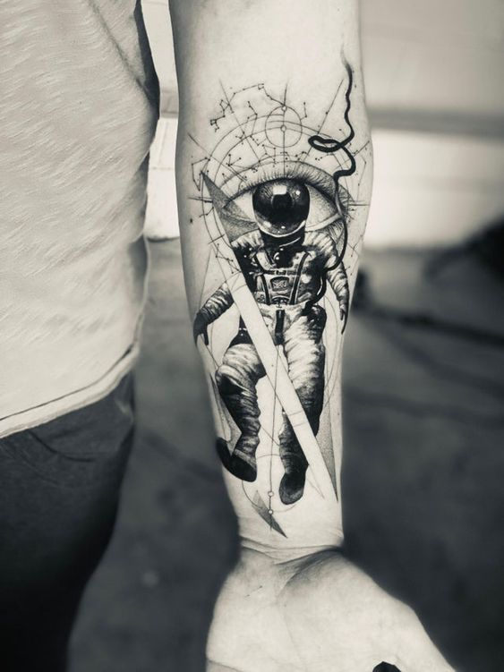 An Astronaut's Helmet is Also an Eye forearm tattoo Tattoo on skin