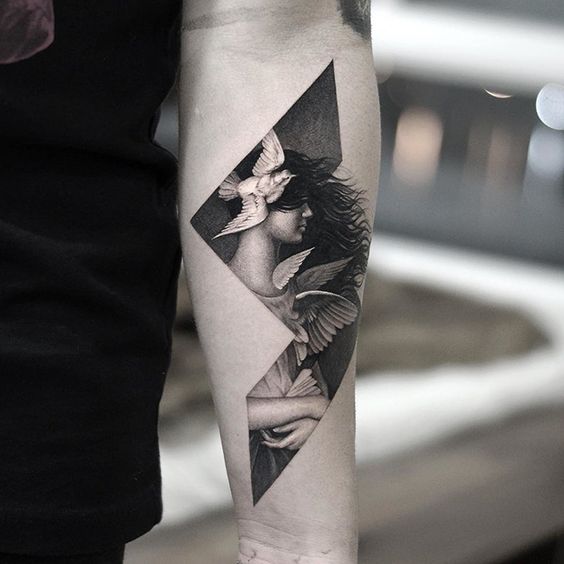 Bold Profile of a Woman and Birds Tattoo on skin